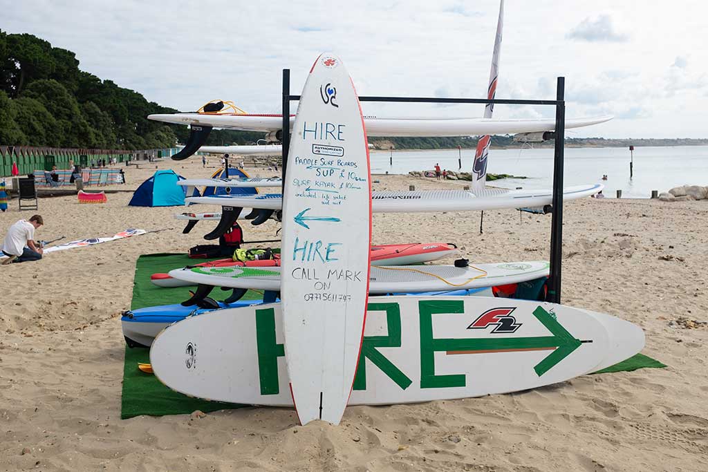 surf boards on the beach for hire