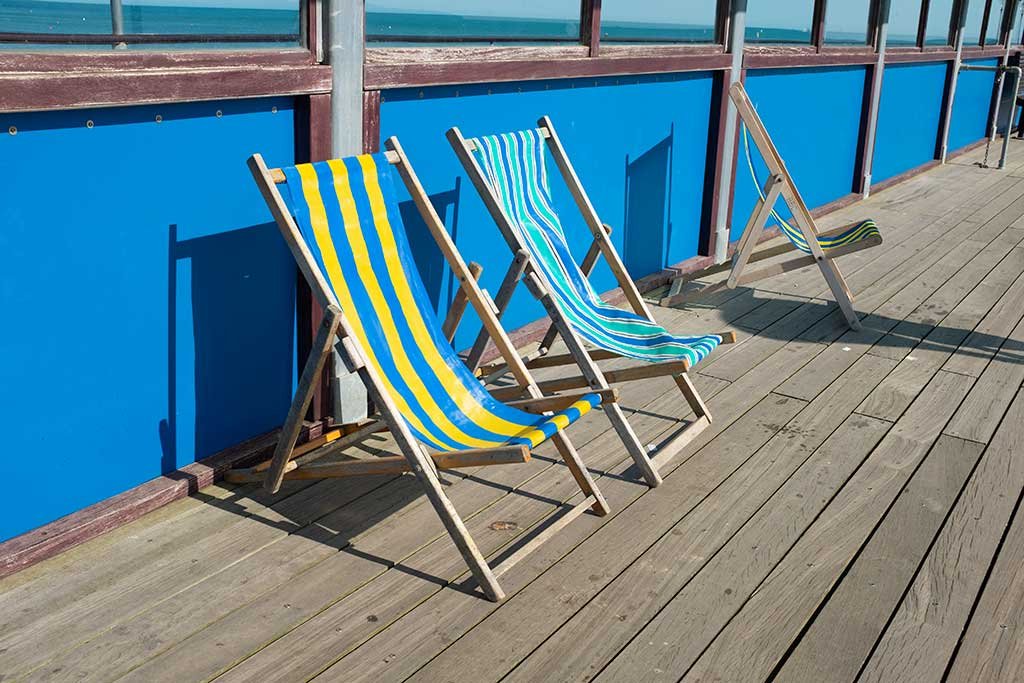 colourful deckchairs on the pier