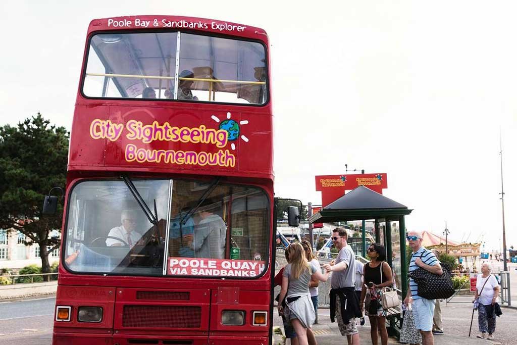 City Sightseeing Bus departing from Bournemouth Pier Approach bus stop