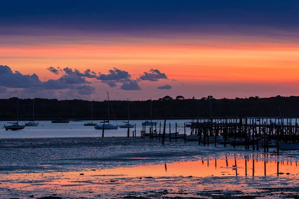 Sunset at the bottom of Evening Hill looking across the harbour to Brownsea Island
